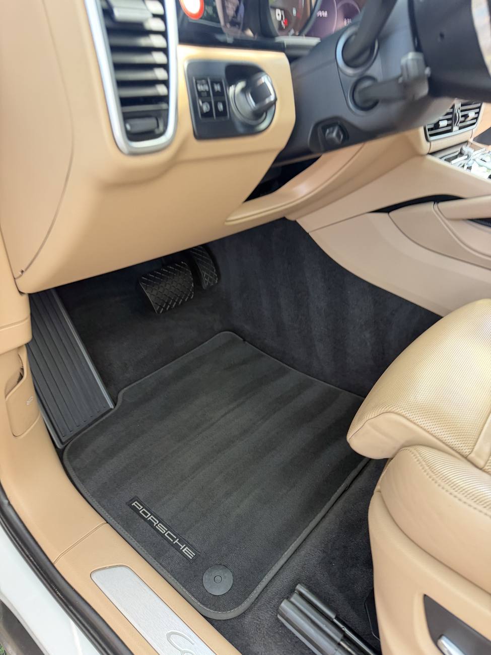 Porsche Cayenne driver footwell after full detail Orlando FL