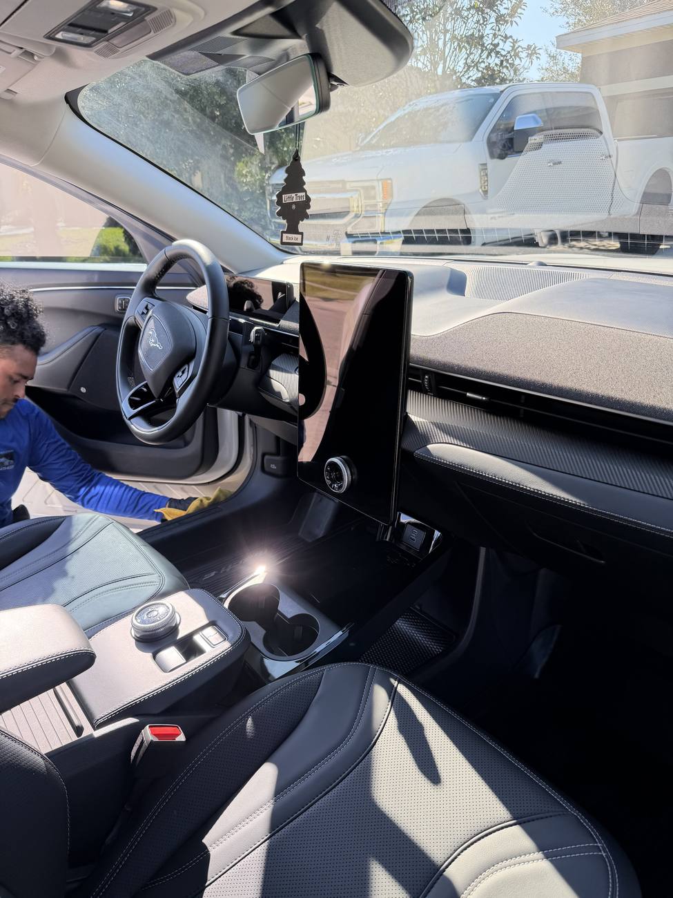 Licona detailer cleaning Tesla interior Orlando FL